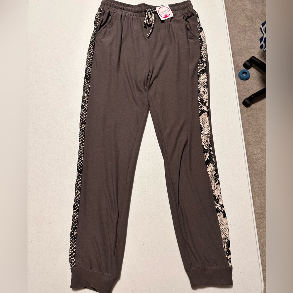 New with tags, never worn. Very soft with pockets.